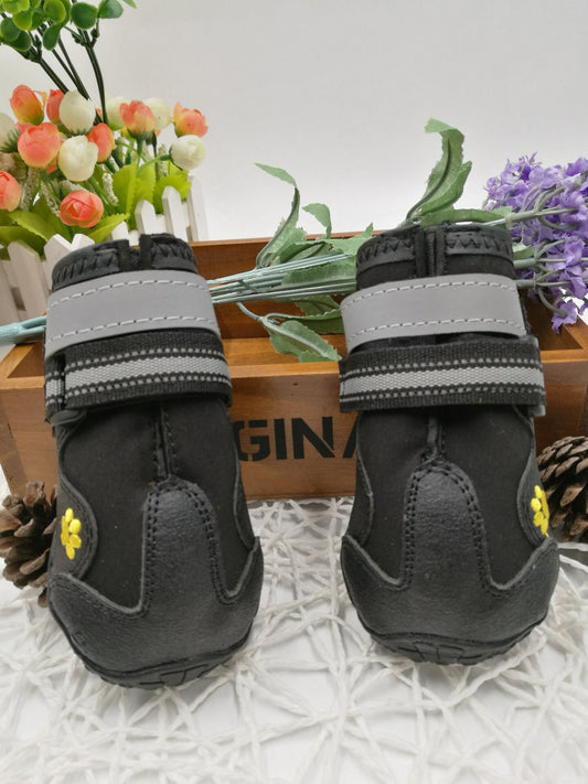 Black dog shoes with anti-slip tread soles for winter paw protection